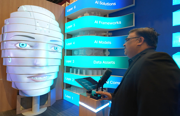 Visitor interacts with a Jio AI installation inside a technology exhibit